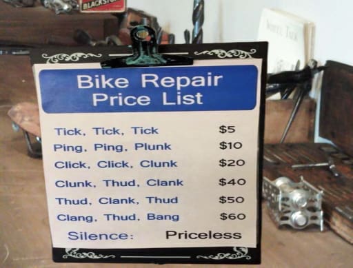 Bicycle Repair price list. the sign tells you how to get faster service